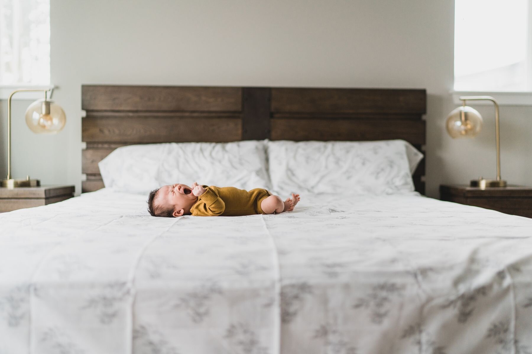 Bellevue Newborn girl on big bed lifestyle