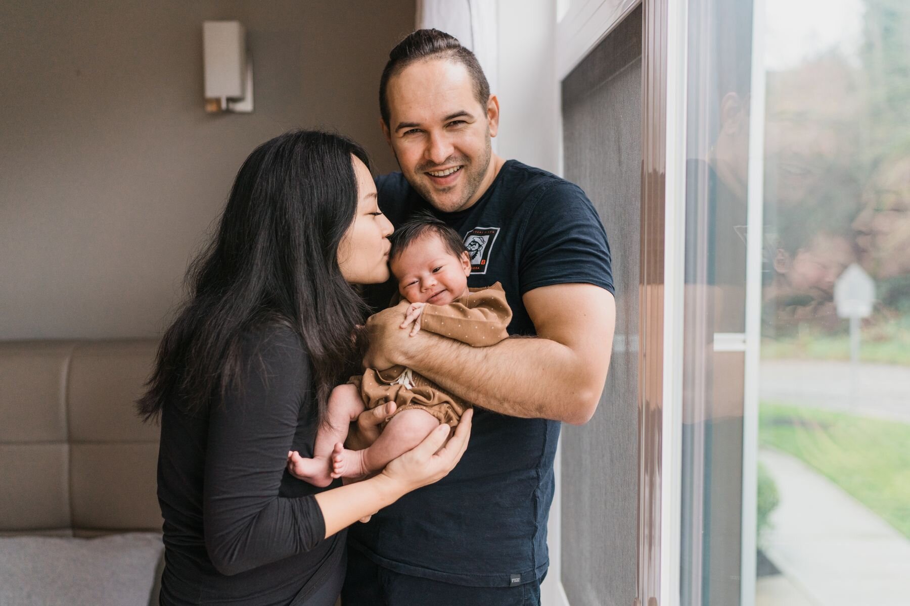 Seattle newborn family heartwarming smile