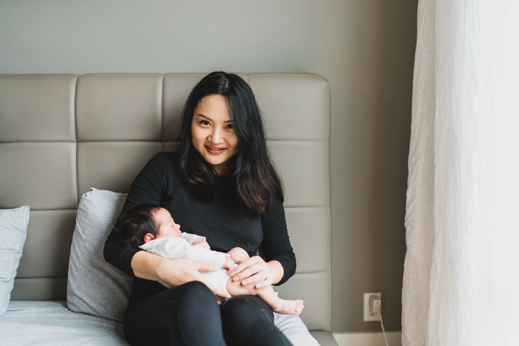 Seattle new mom holding her newborn
