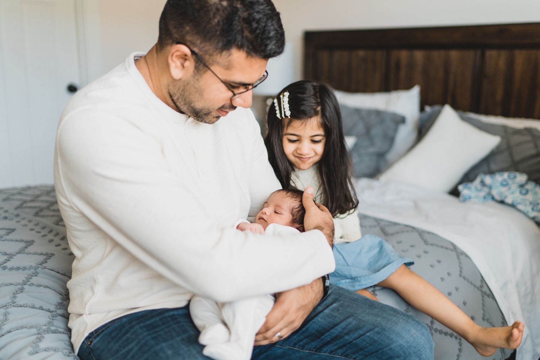 Issaquah newborn in home lifestyle dad with two kids
