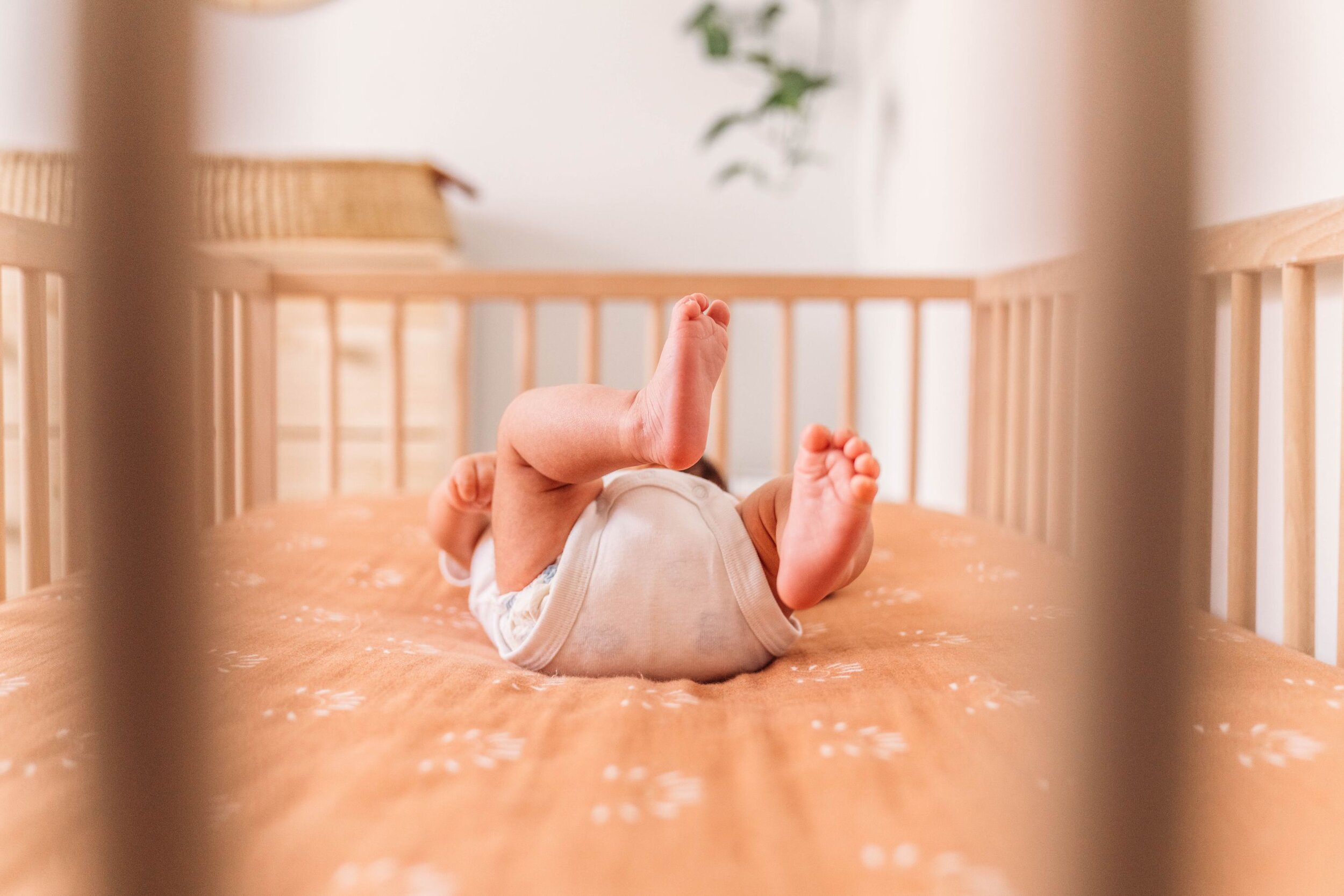 Issaquah newborn baby boy in his crib