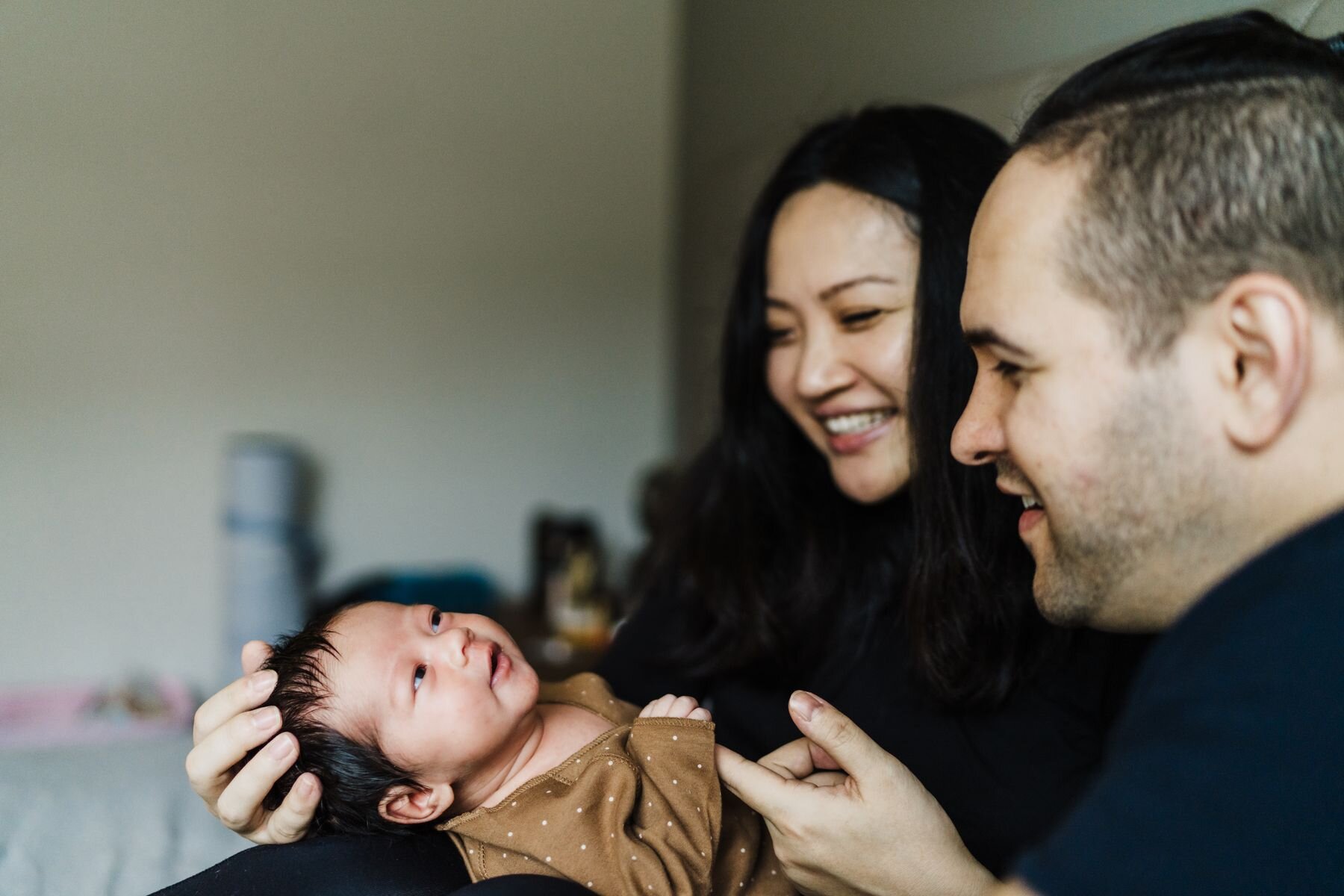 Seattle newborn baby bonding with parents